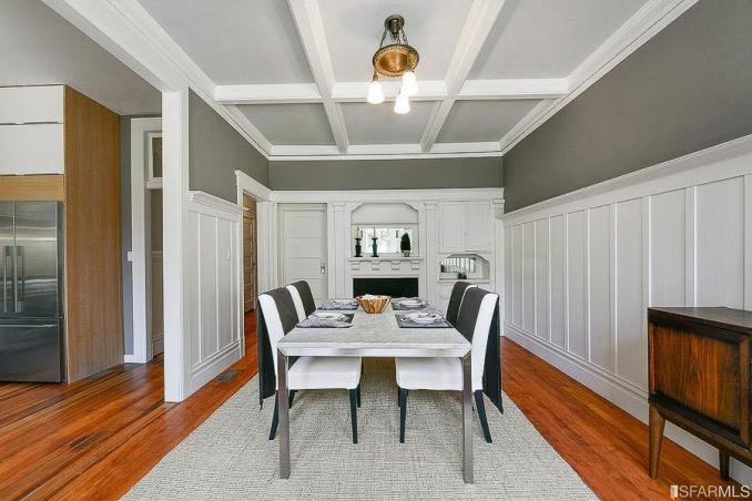 Property Thumbnail: Formal dining room with boxed ceilings, wood floors and fireplace