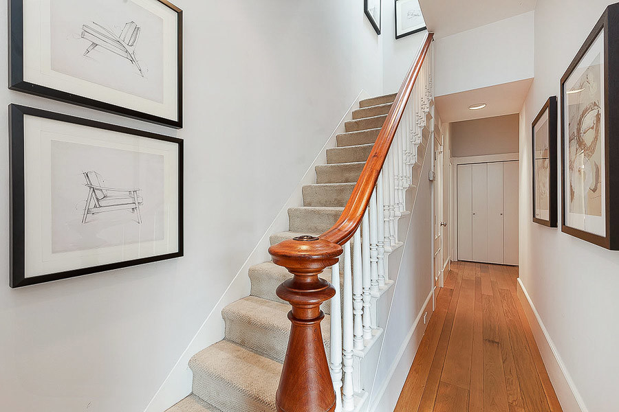 Property Photo: Steps leading up, featuring beautiful wood railing 