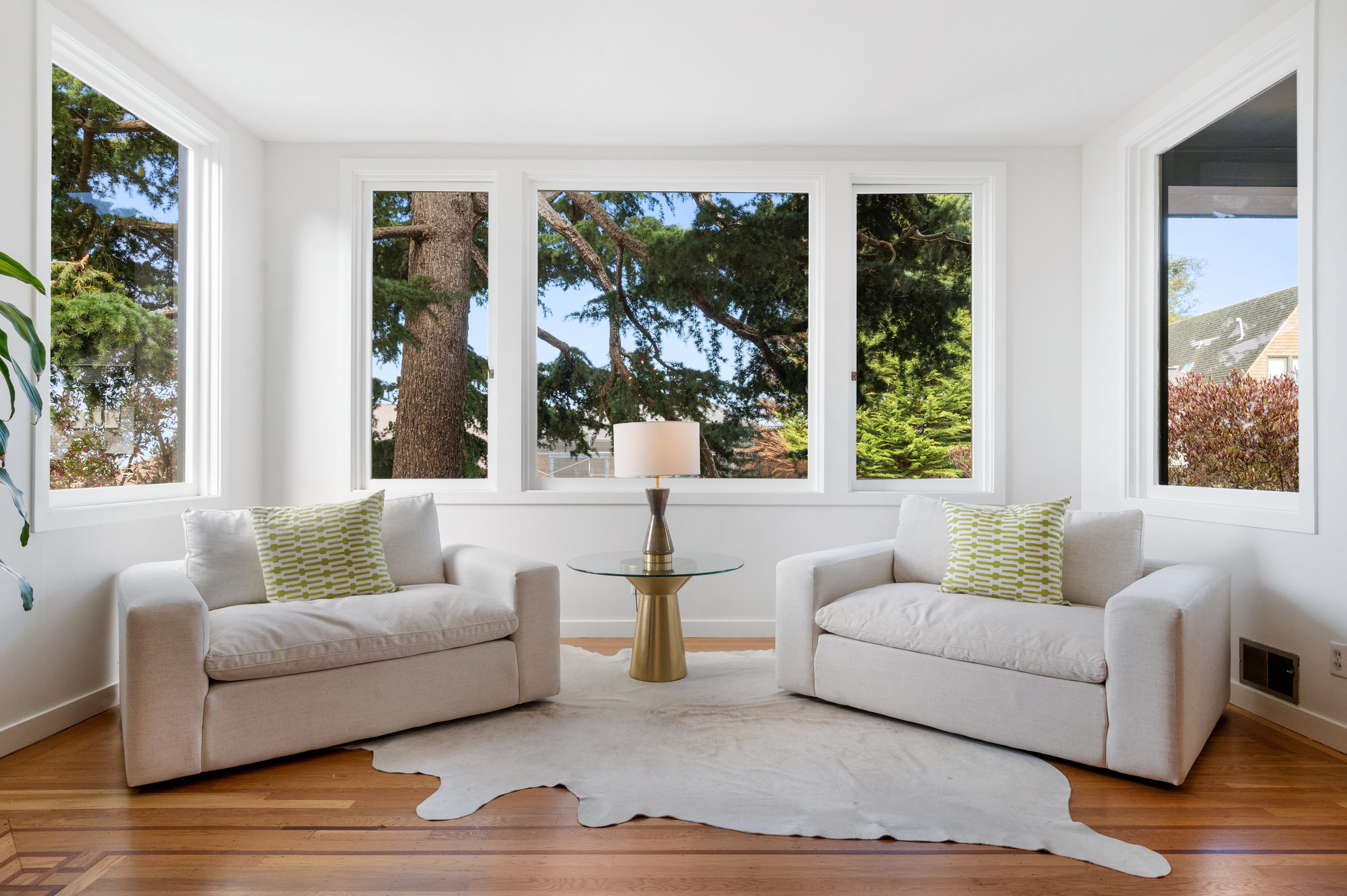 Property Photo: Close-up of a sitting area with wrap-around windows on three sides