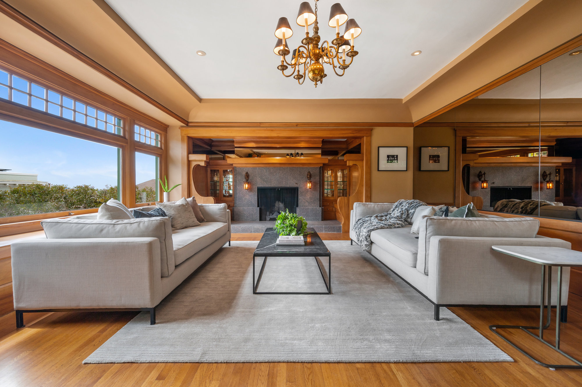 Property Photo: Living room featuring rich Craftsman architectural elements and woodwork