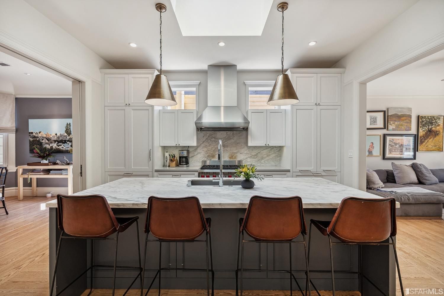 Property Photo: View of the large kitchen island with seating for four people