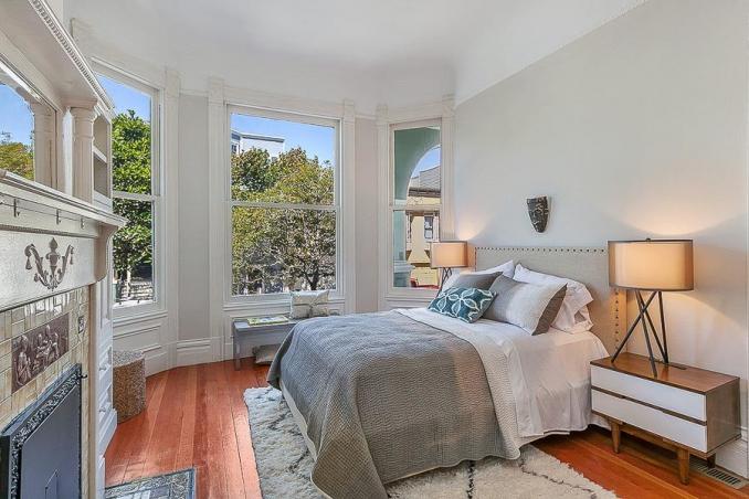 Property Thumbnail: Bedroom with three large floor-to-ceiling windows
