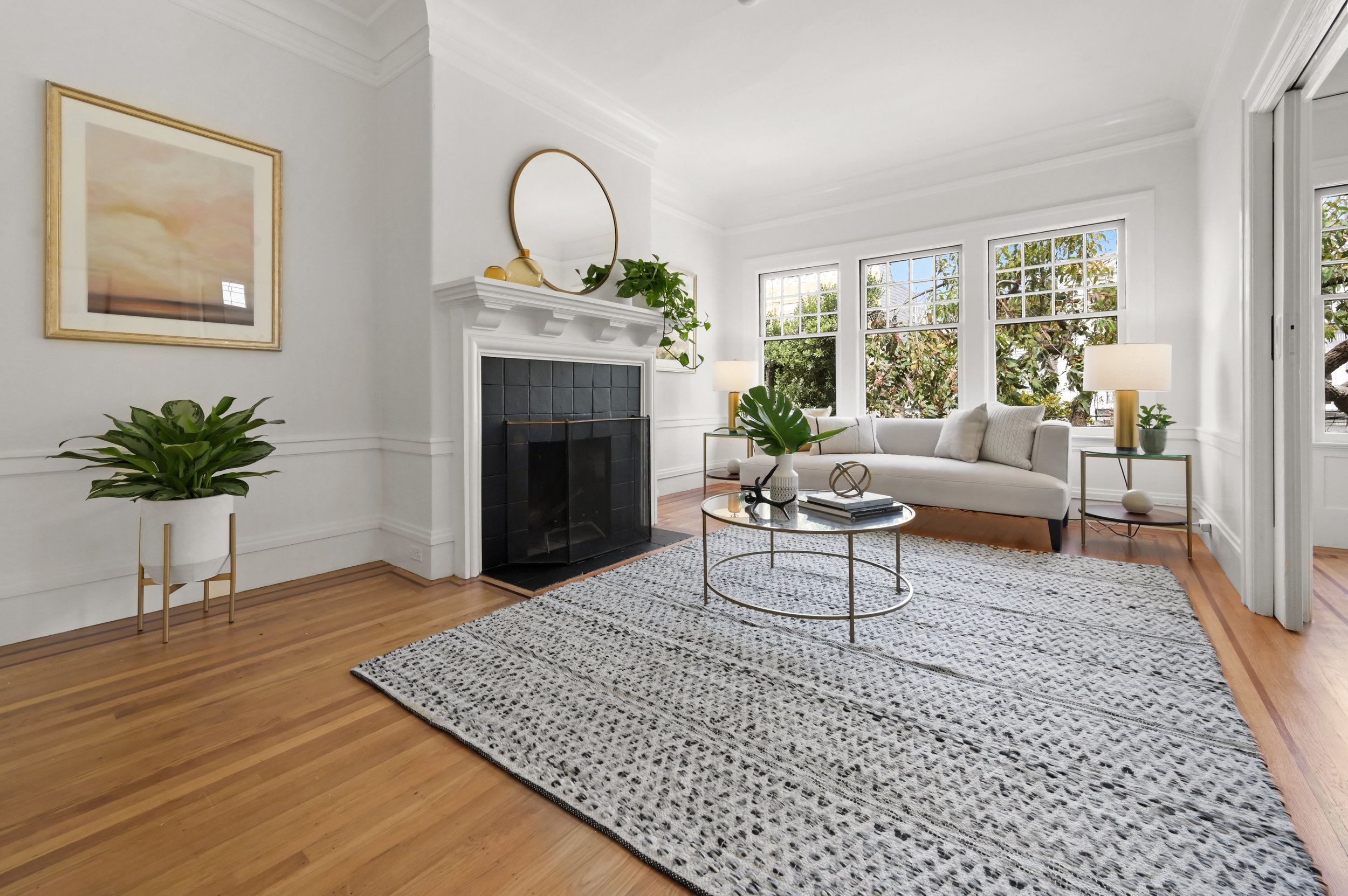 Property Photo: Living room featuring a fireplace and wood floors