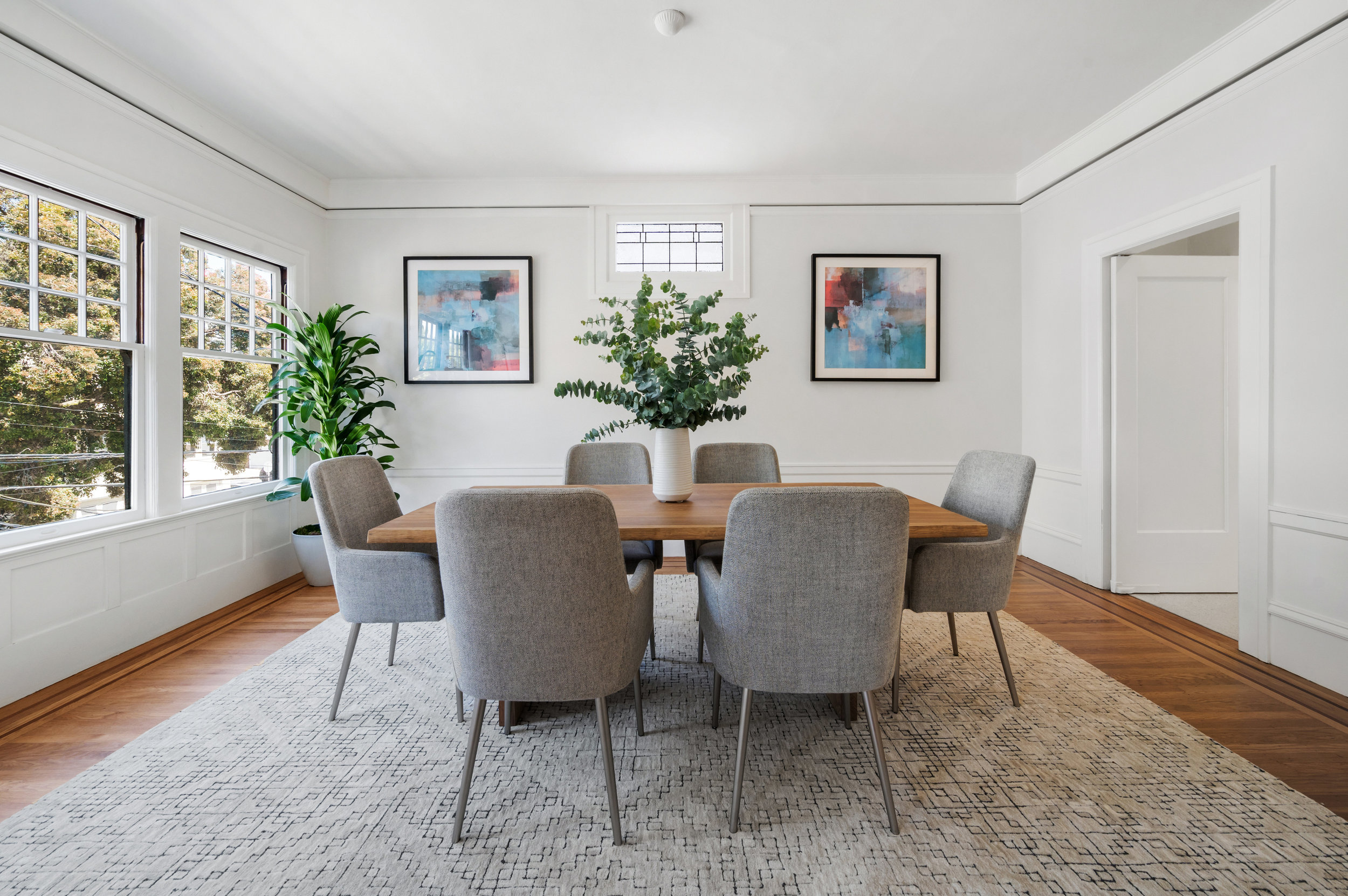 Property Photo: View of the formal dining room at 637-639 Lake Street, featuring wood floors