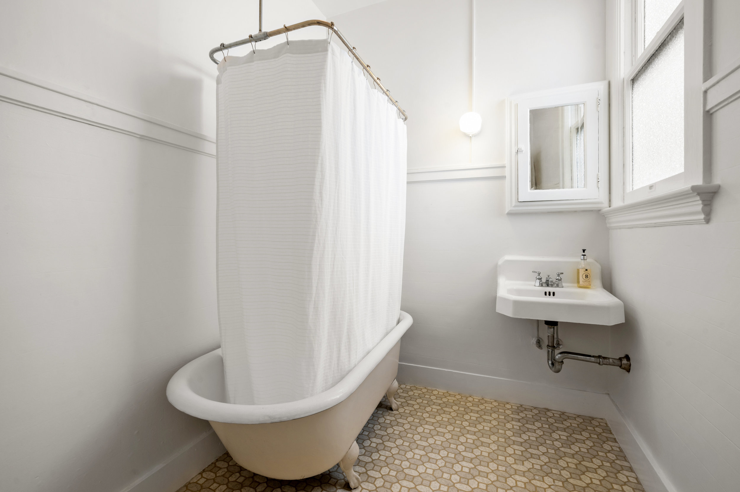 Property Photo: Bathroom with free-standing clawfoot bath tub