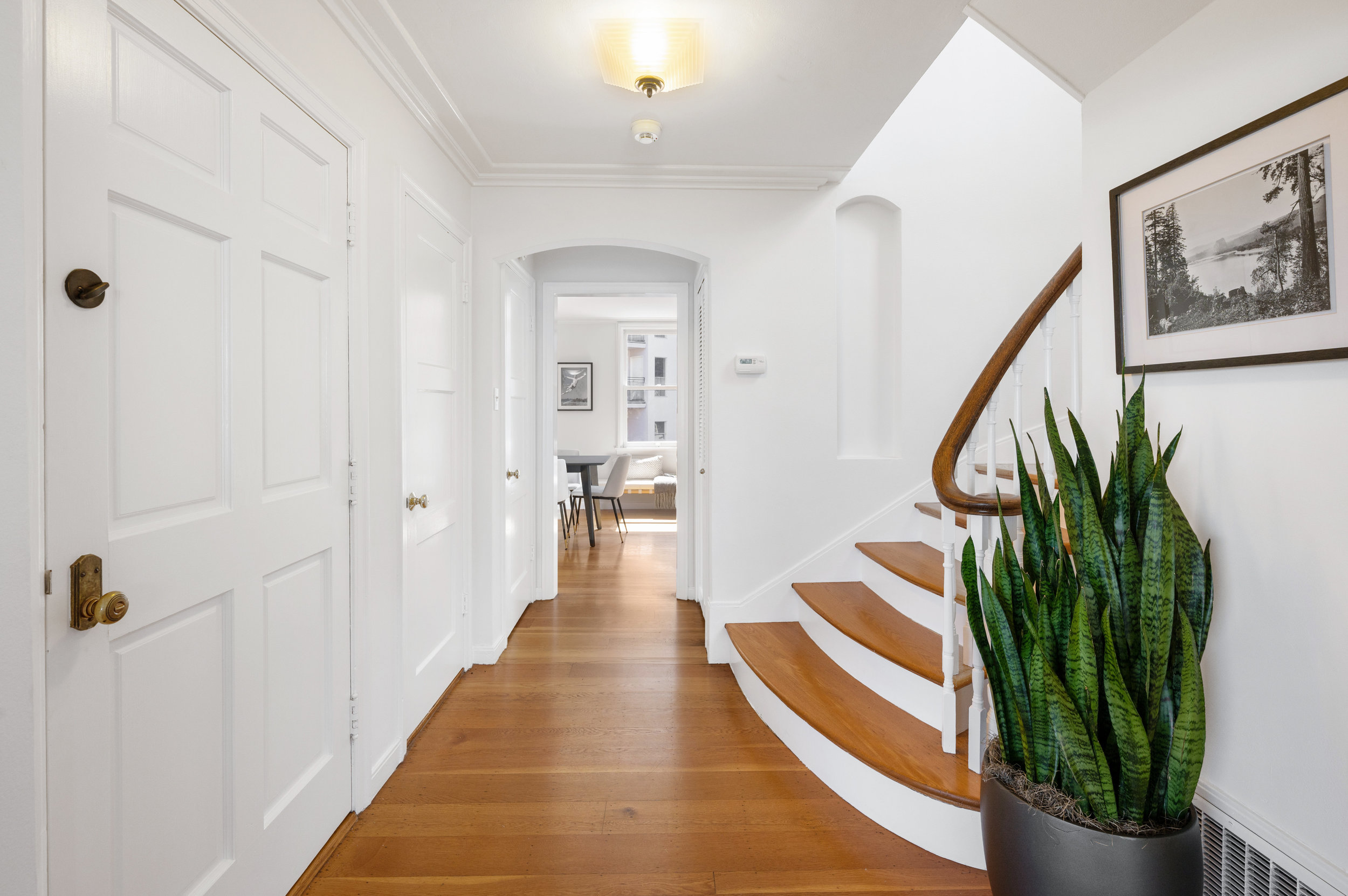 Property Photo: Hallway with beautiful wood floors 