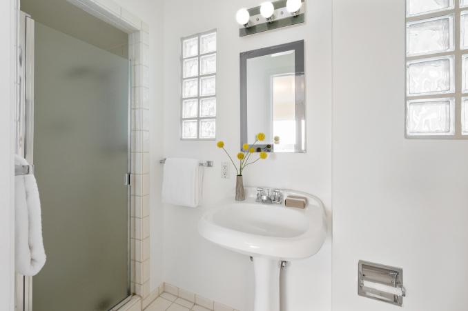Property Thumbnail: Second bathroom, featuring a shower and block glass windows