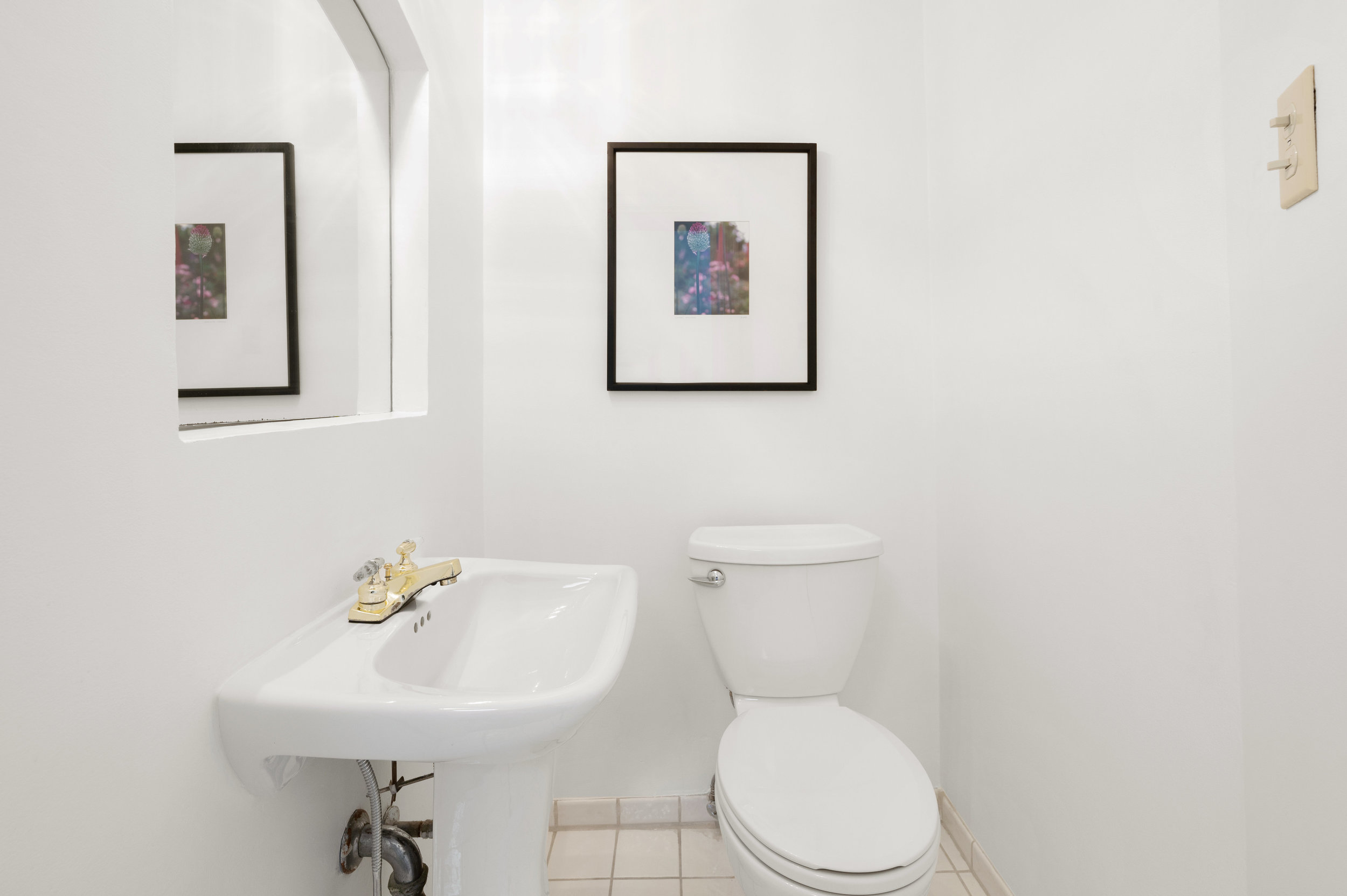 Property Photo: Bathroom three, showing a small vanity