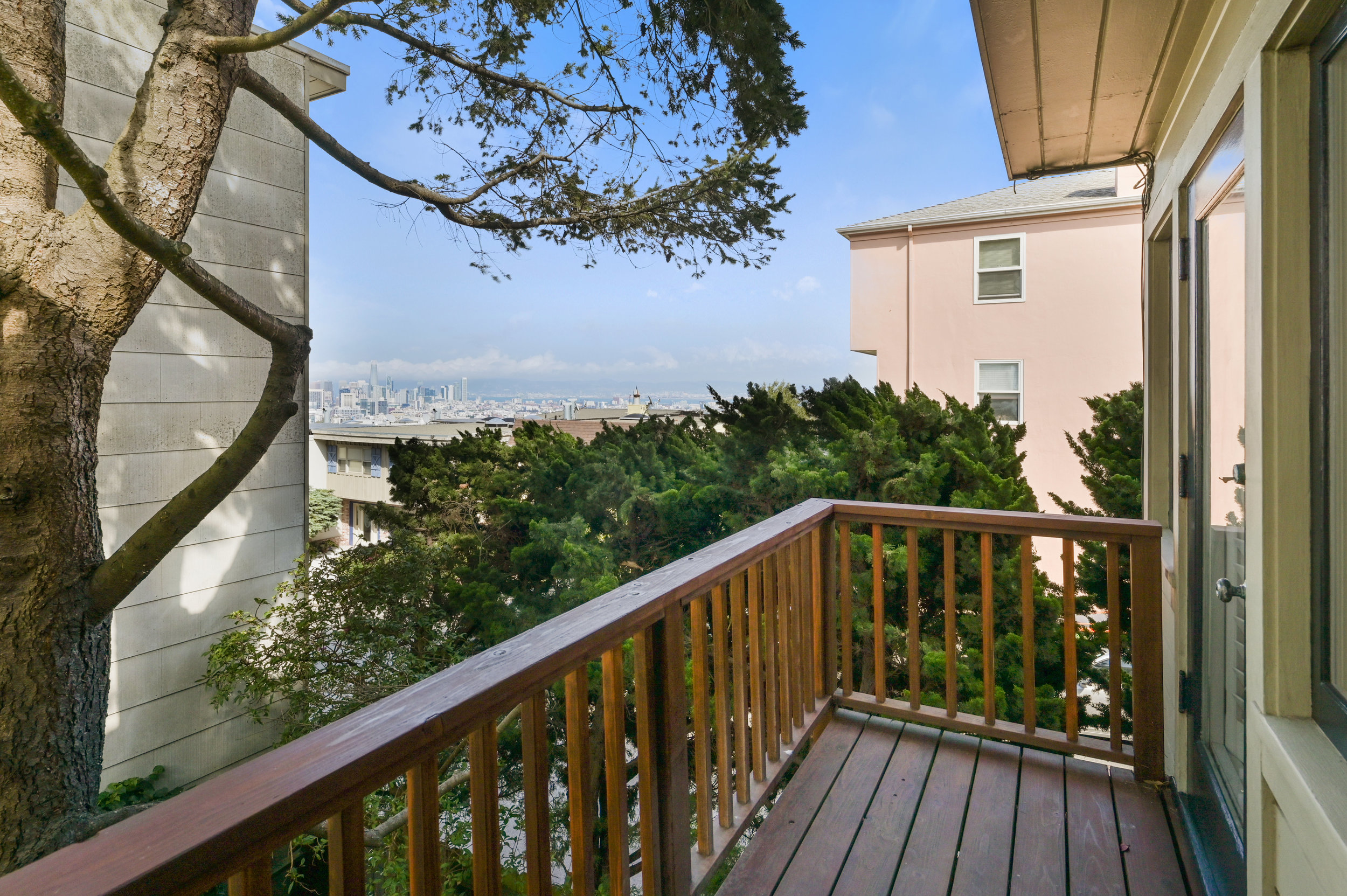 Property Photo: View from the upper deck off the living room, showing the San Francisco skyline
