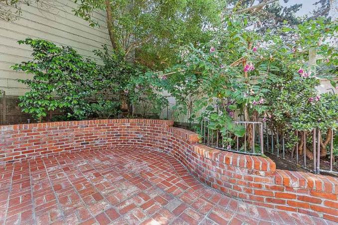 Property Thumbnail: Close-up view of the brick patio and surrounding plants