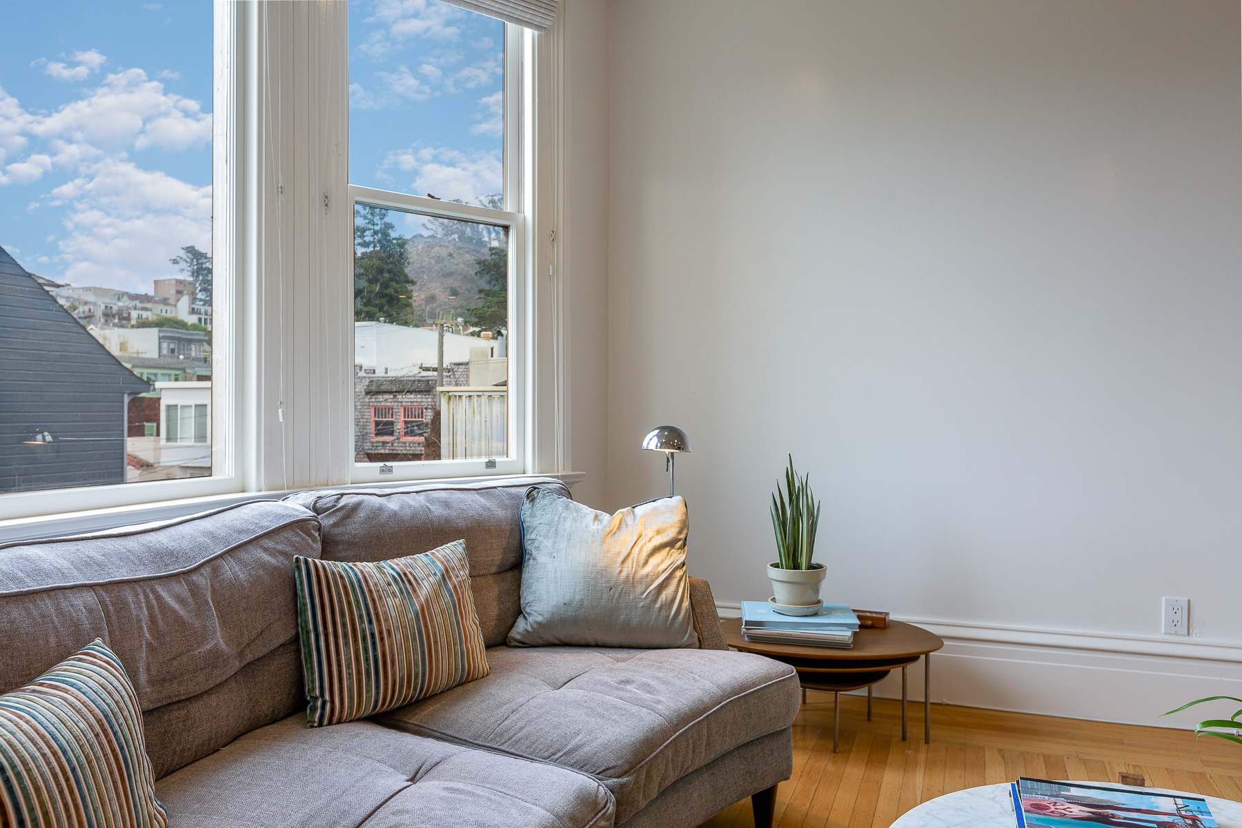 Property Photo: Close-up view of the living room sitting area with a view of Cole Valley beyond