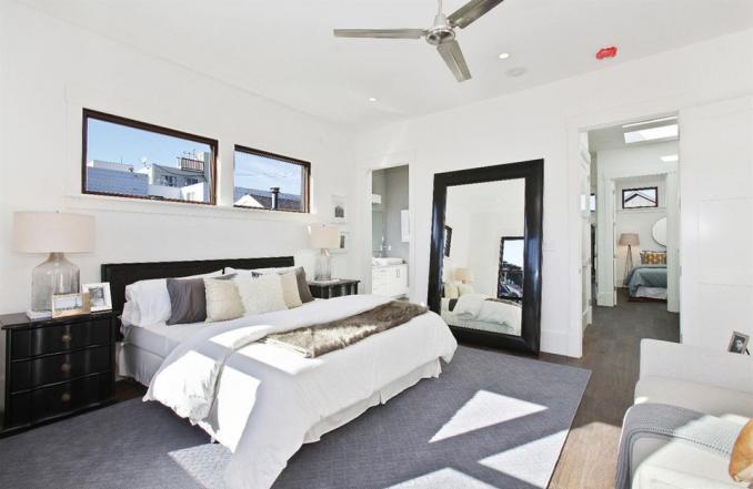 Property Thumbnail: View of a large bedroom, with two long windows
