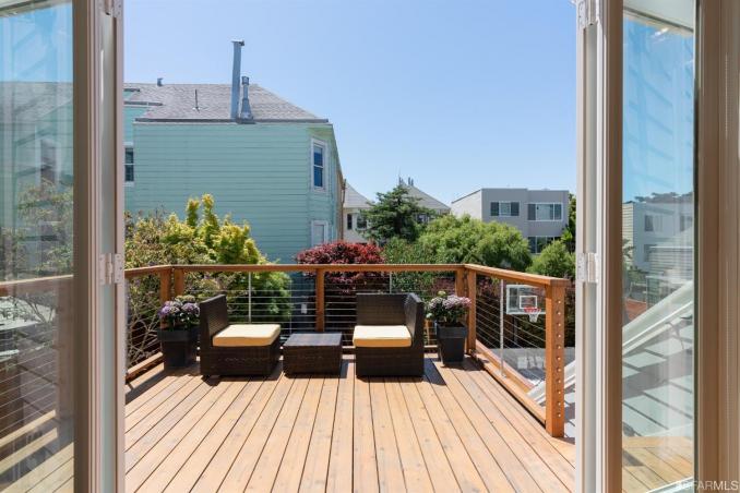 Property Thumbnail: View from open doors of the walk-out deck adjoining the kitchen