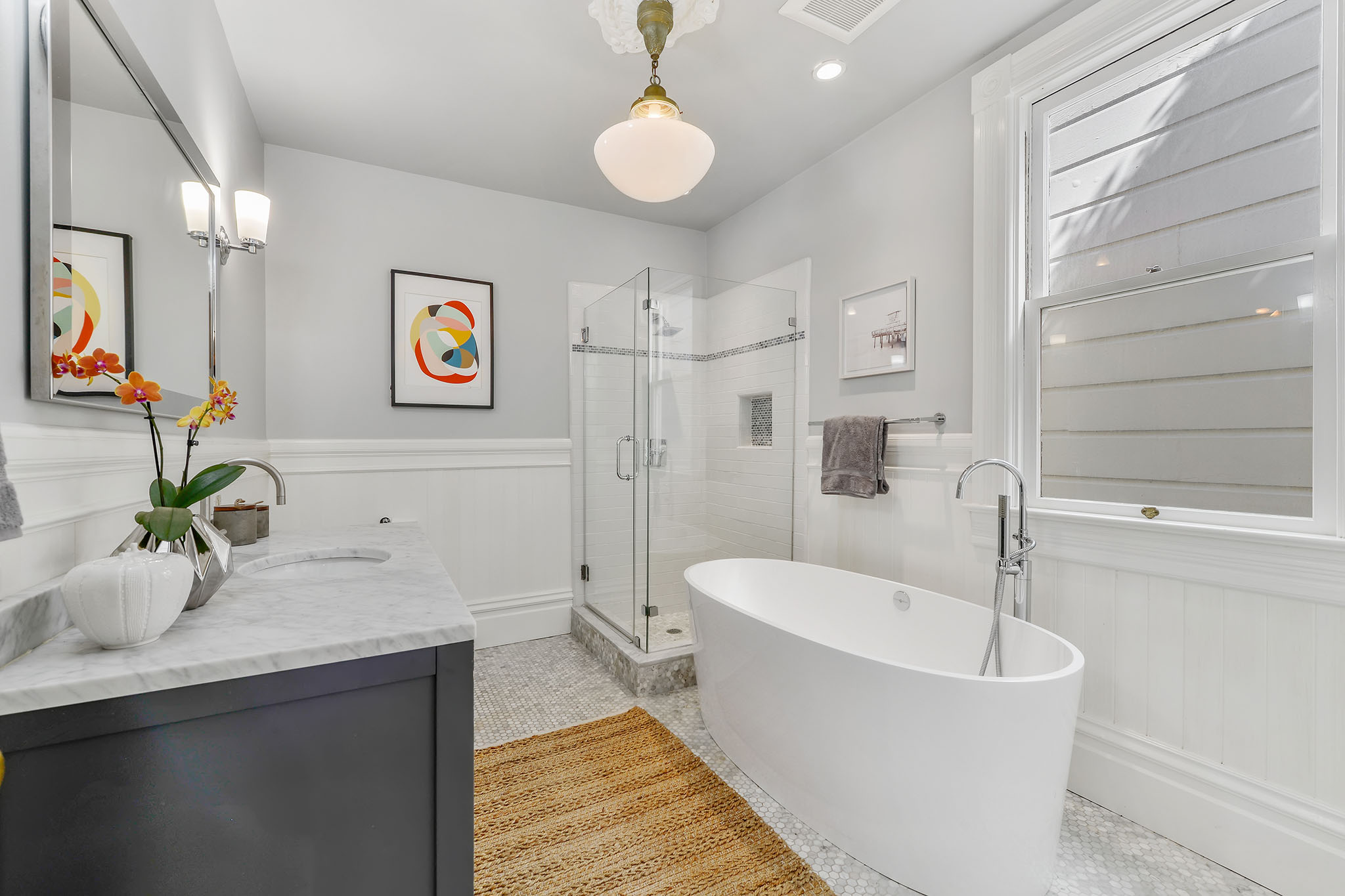 Property Photo: View of a bathroom with a large soaking tub set beneath a window