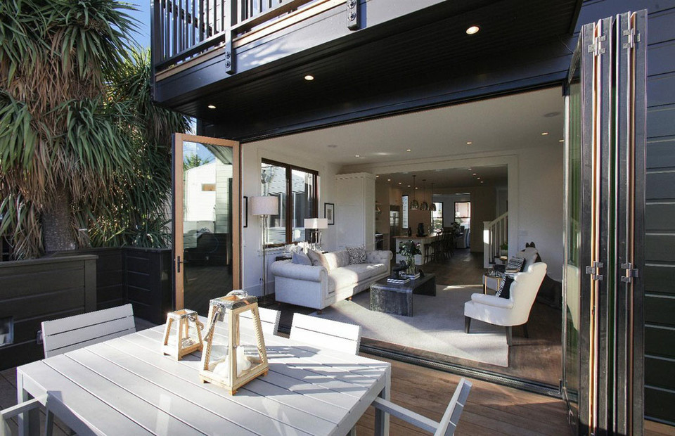 Property Photo: View of the living room from an outdoor dining area
