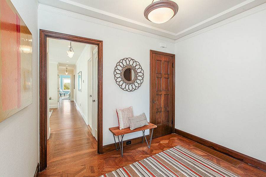 Property Photo: View of the front foyer, featuring wood floors