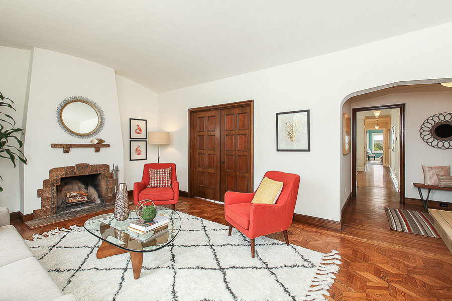 Property Photo: View of the living room, featuring wood floors