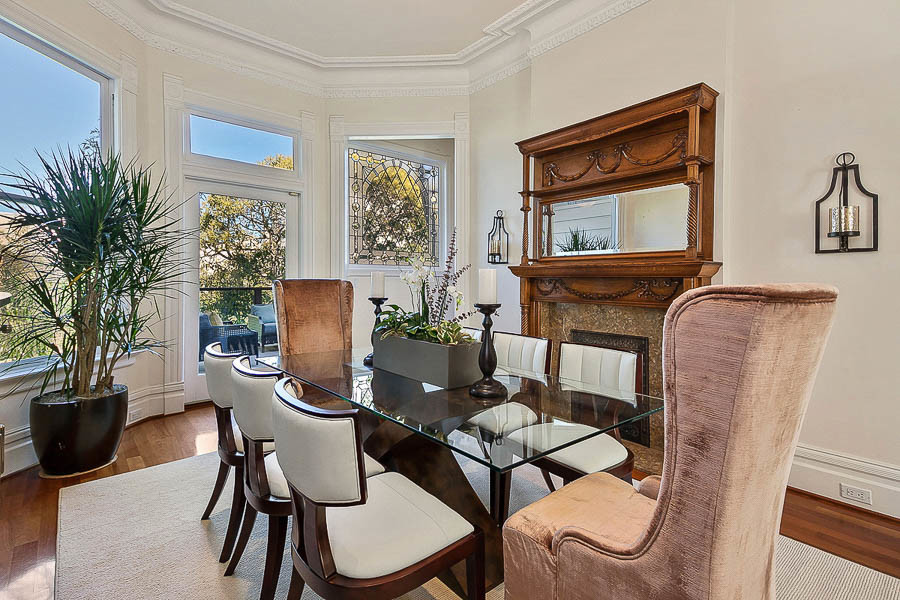 Property Photo: View of the formal dining room, featuring a large fireplace