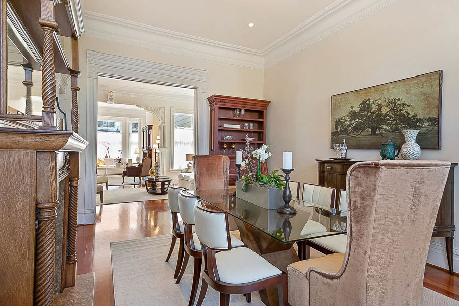 Property Photo: View of the formal dining room, featuring crown moulding and wood floors