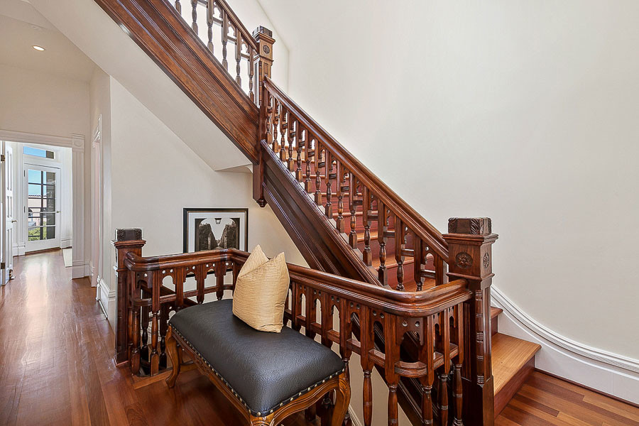 Property Photo: View of another set of wood steps and railing leading upwards