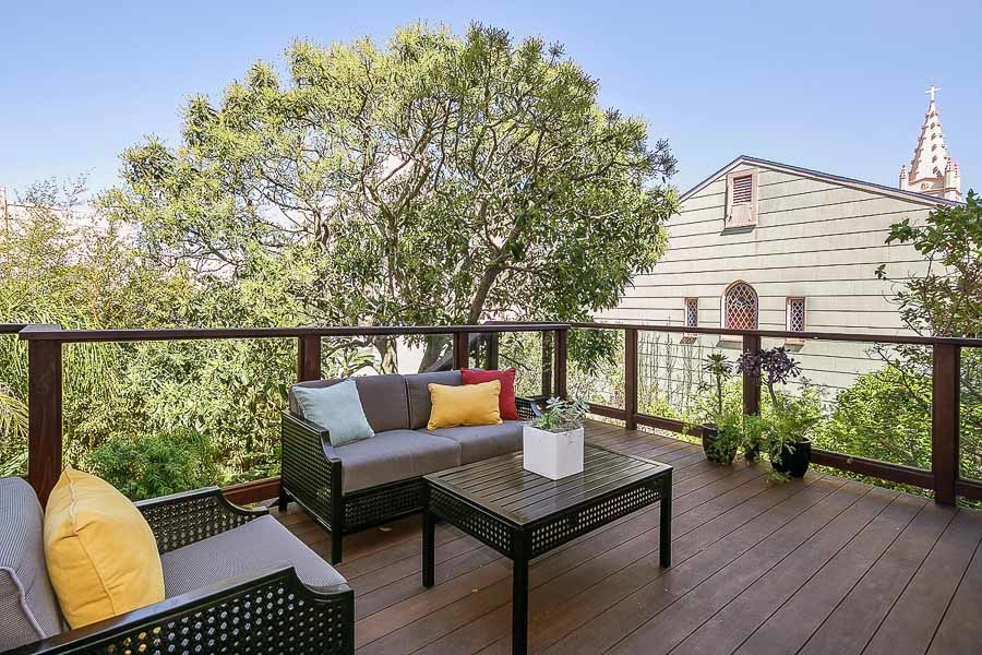 Property Photo: View of a large wood deck and outdoor living area