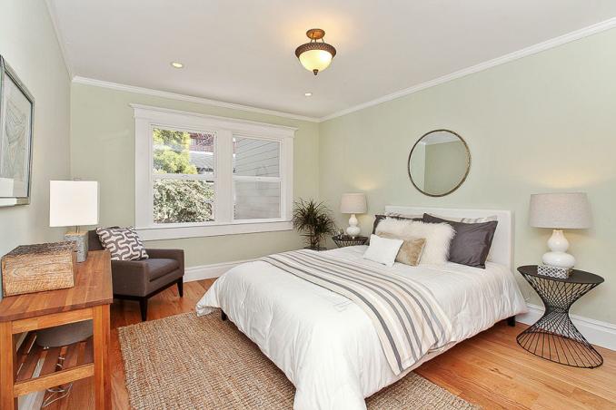 Property Thumbnail: View of a bedroom, featuring large windows and wood floors