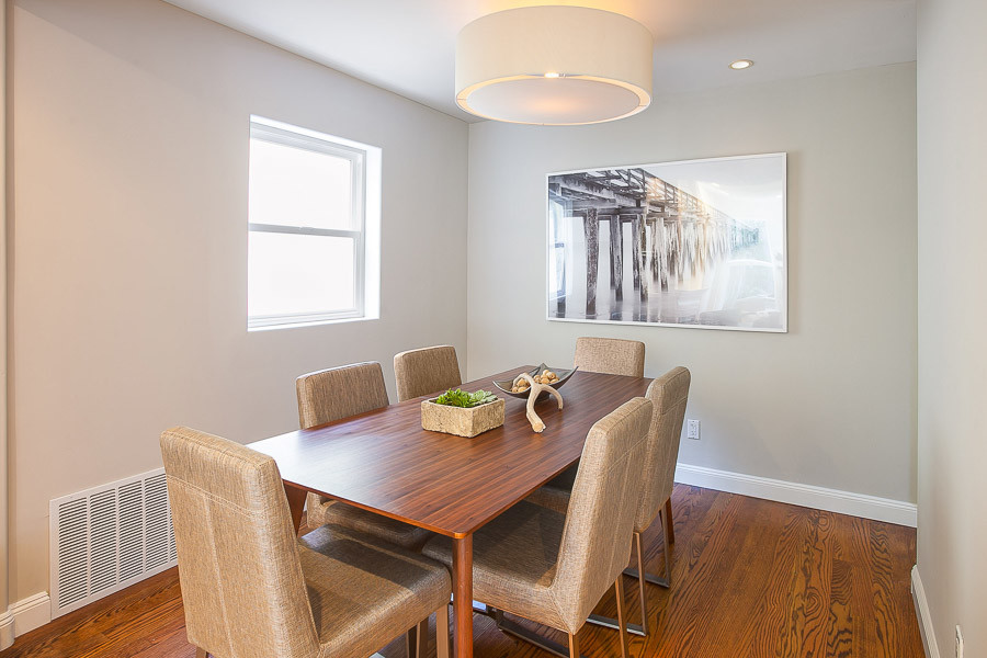 Property Photo: View of the formal dinning room with wood floors