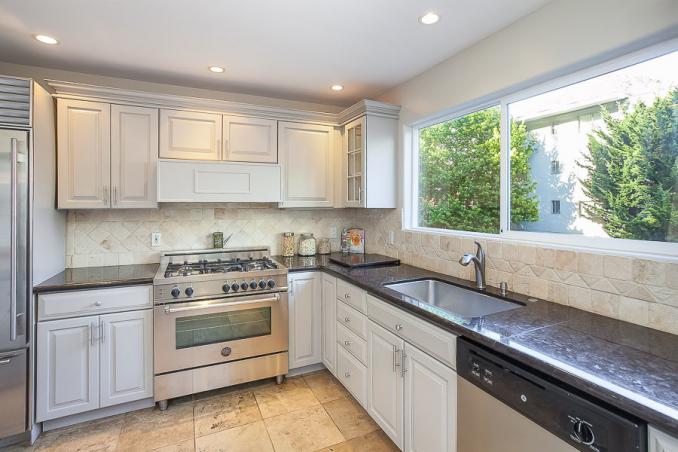 Property Thumbnail: Kitchen, featuring tile floors and white cabinets 