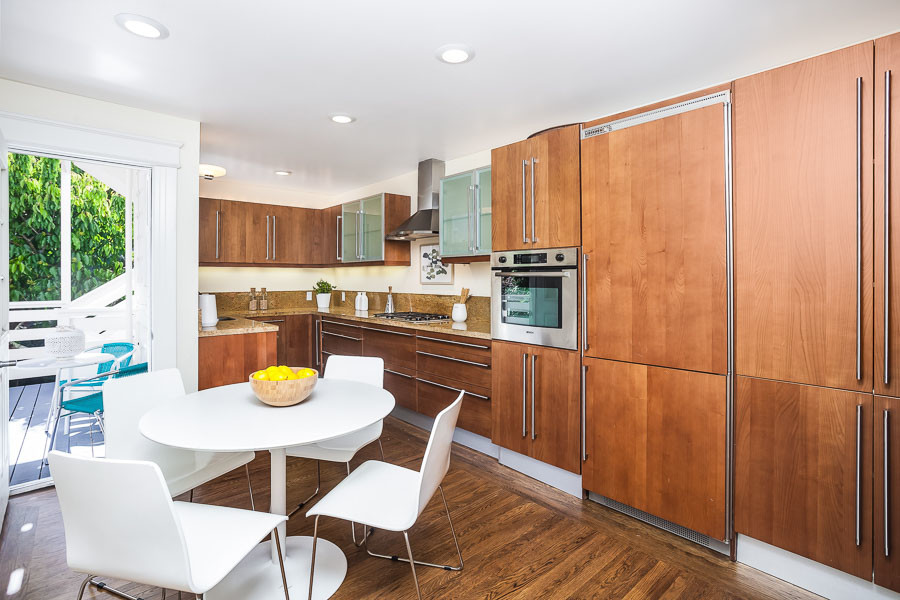 Property Photo: View of the kitchen, showing large wood cabinets