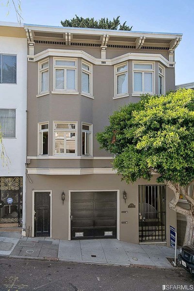 Property Photo: Font exterior view of 41 Delmar Street, showing a home with dark tan facade