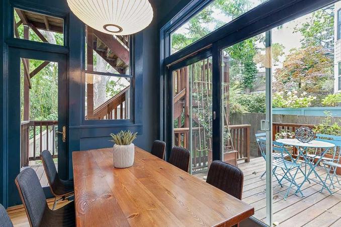 Property Thumbnail: View of a dining room with wall-to-wall doors and windows