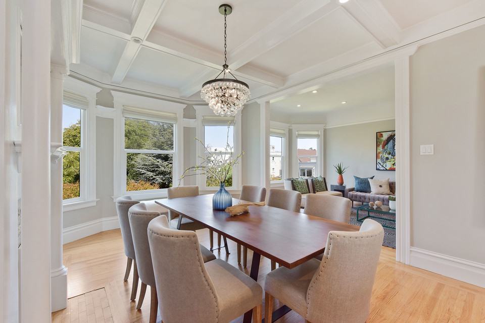 Property Photo: View of the formal dinning room, featuring wood floors and a boxed ceiling 
