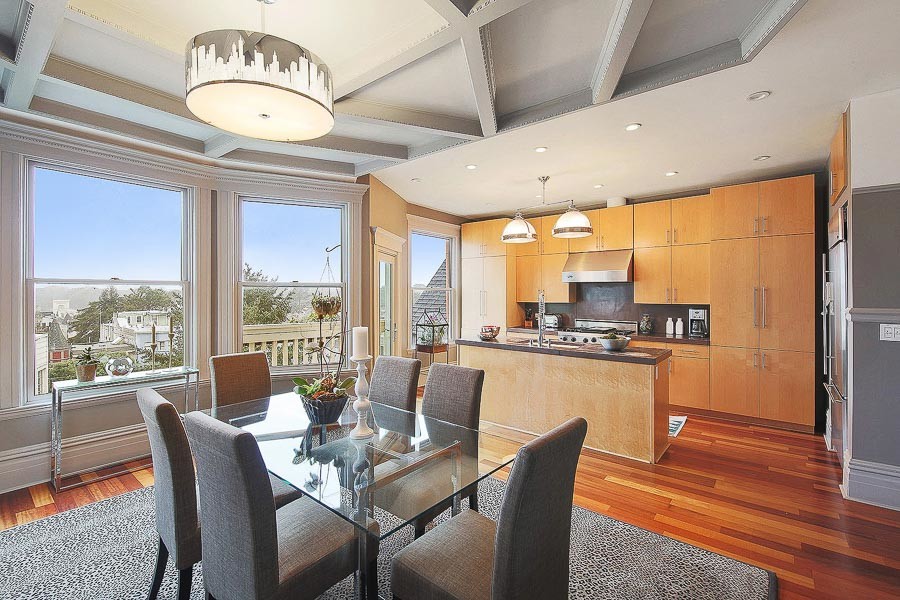 Property Photo: Open floor plan view of a dining area and kitchen 