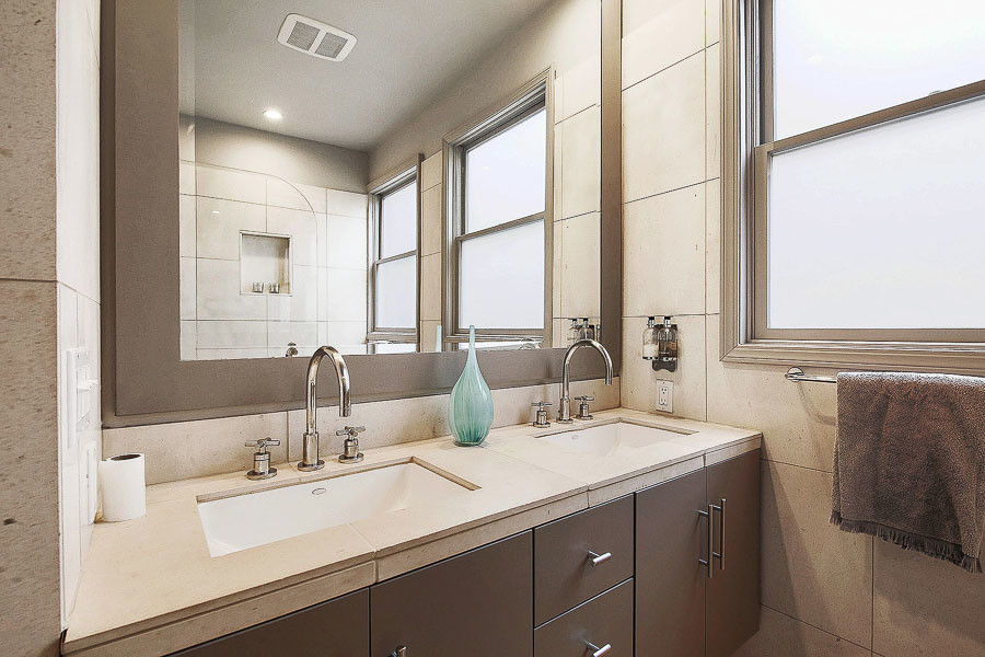 Property Photo: View of a bathroom with two sinks 