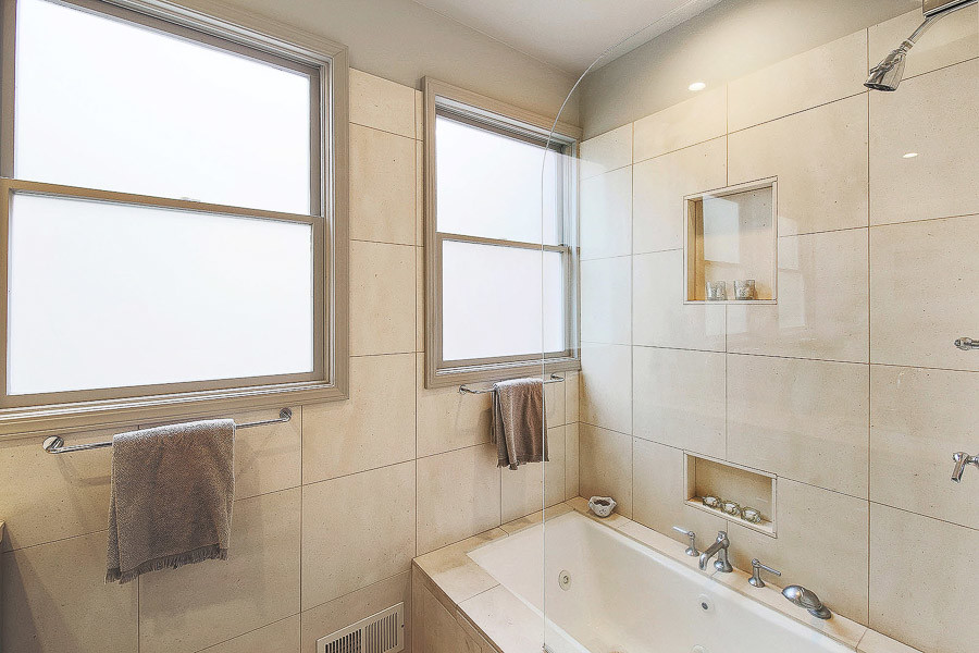 Property Photo: Bathroom with tub and large window