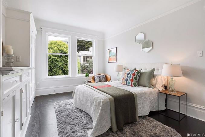 Property Thumbnail: Bedroom with wood floors and two large windows