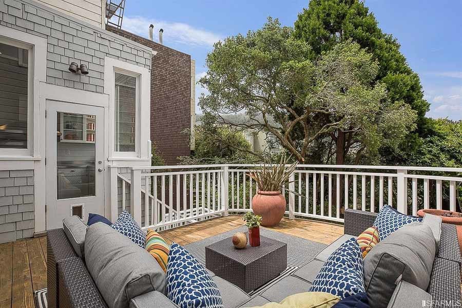 Property Photo: Outdoor living area with a view of trees beyond