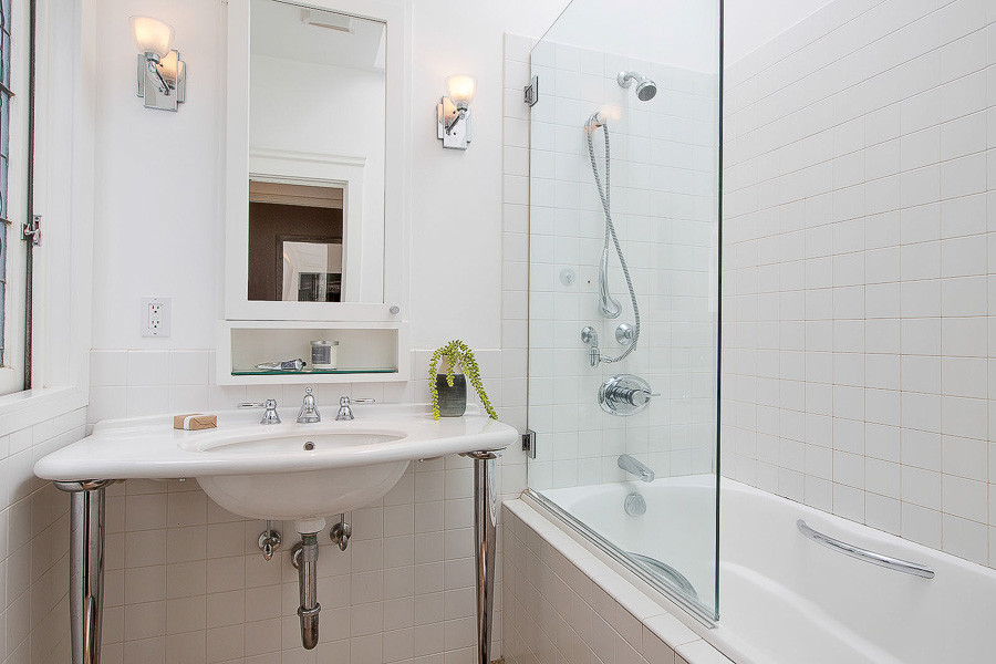Property Photo: Bathroom with tub and sink