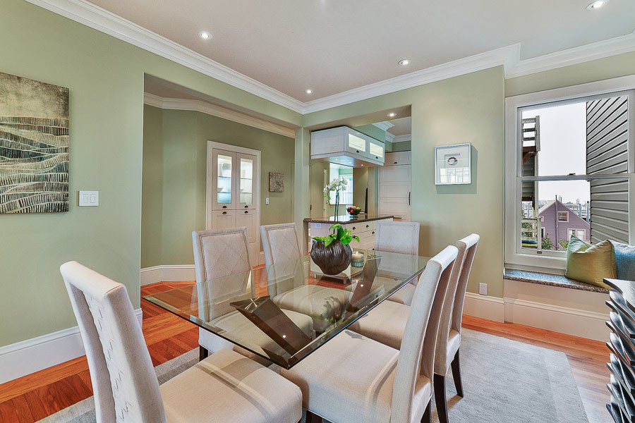 Property Photo: View of the formal dining room, featuring wood floors