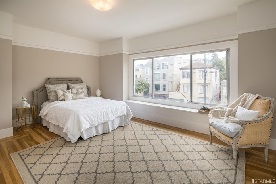 Property Photo: View of a large bedroom with plenty of natural light