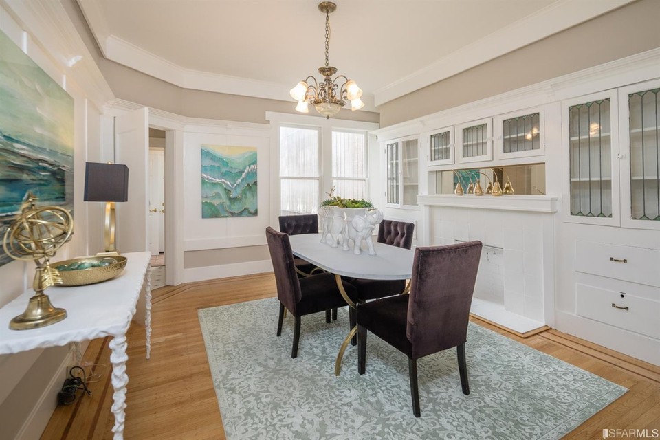 Property Photo: View of the dining room with crown moulding and built-in cabinets