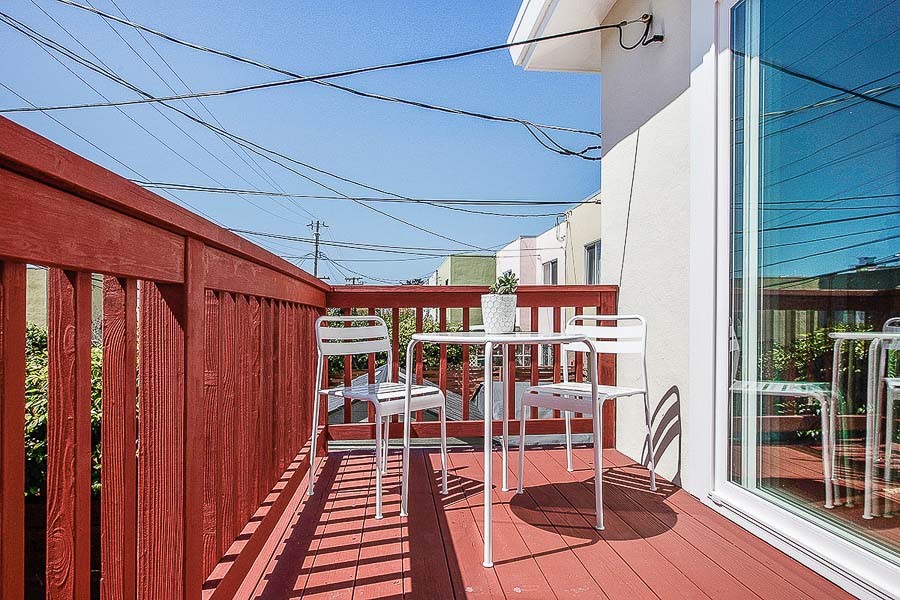 Property Photo: View of the deck and outdoor dining area