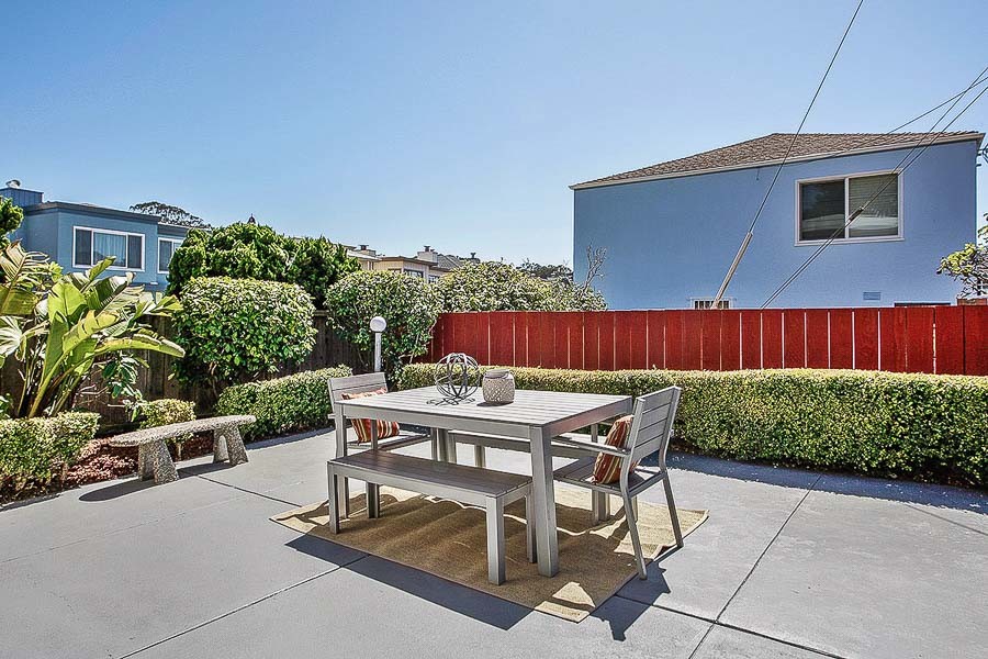 Property Photo: View of a large patio and outdoor dining area