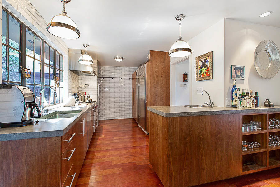 Property Photo: Kitchen with wood cabinets and wood floors