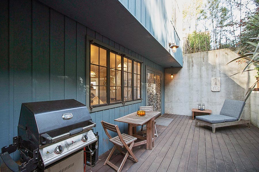 Property Photo: View of an out door dining, lounge, and grill area