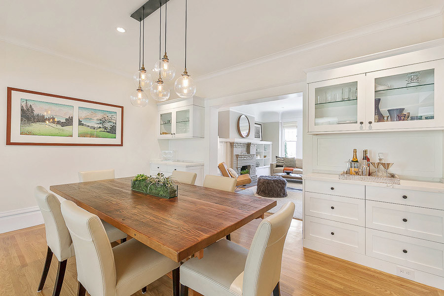 Property Photo: Formal dining room, featuring wood floors and built-in cabinets