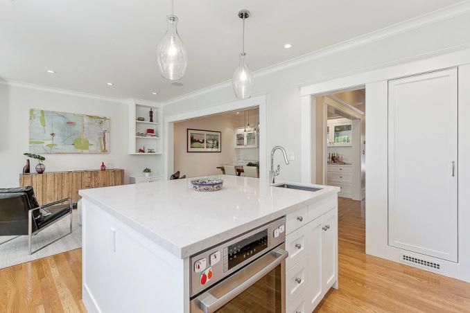 Property Thumbnail: View of the kitchen featuring a white island cabinet with sink