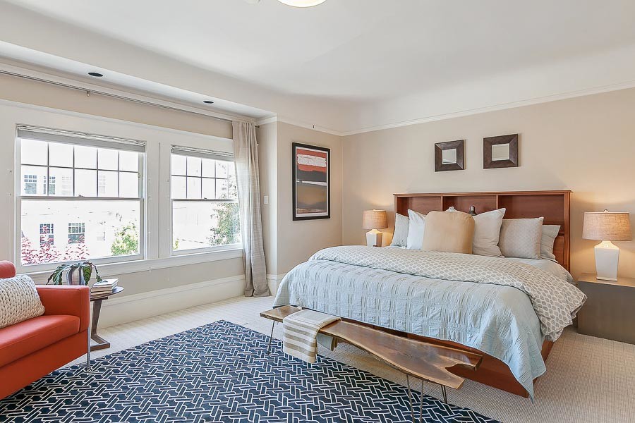 Property Photo: View of a bedroom with large windows 