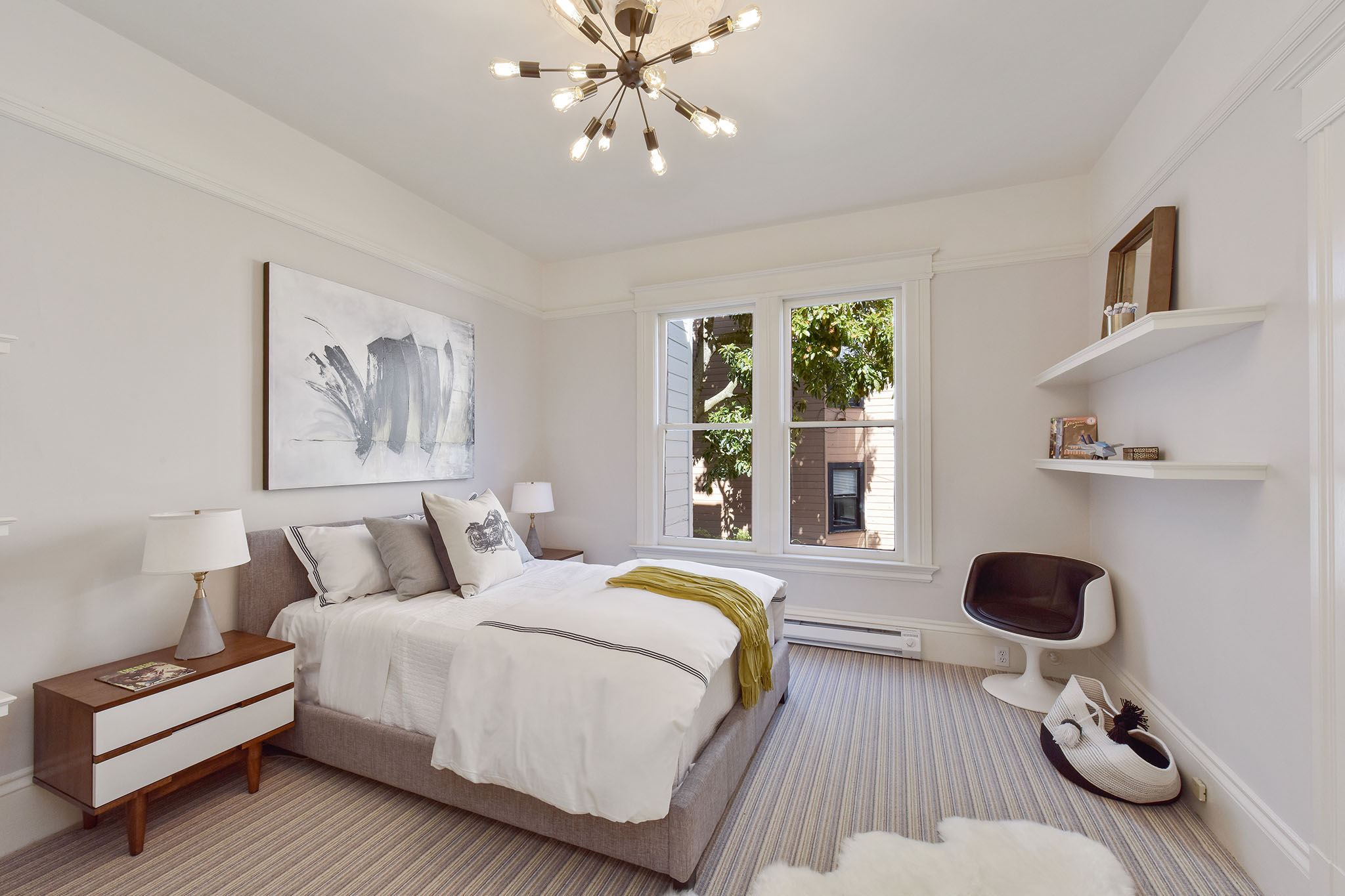 Property Photo: View of a bedroom, featuring large windows and carpeting 