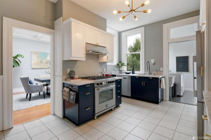 Property Thumbnail: View of the kitchen, showing a stainless stove and window above the sink